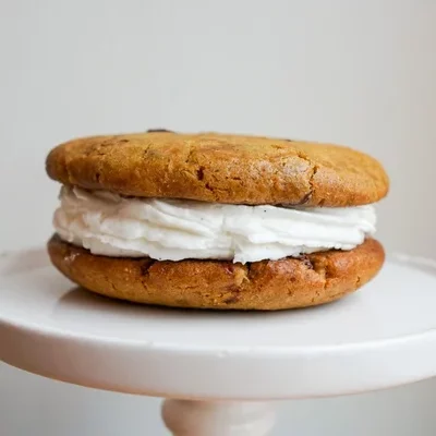 Two of our delicious chocolate chip cookies, sandwiched around a layer of our vanilla buttercream.