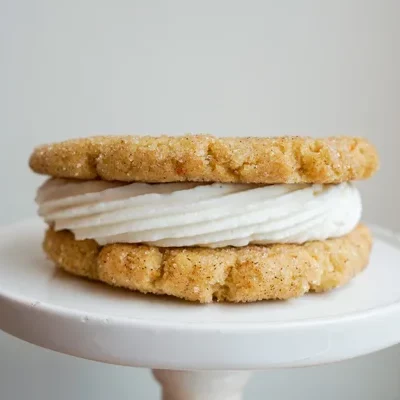 Two of our delicious snickerdoodle cookies, sandwiched around a layer of our vanilla buttercream.