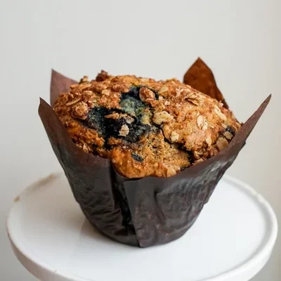 Blueberry Oat Muffin Our best selling muffin packed with 6g of protein and 6g of fibre per muffin! Made with organic oats, coconut milk, wild blueberries and topped with a coconut sugar sweetened crumble.
